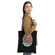 Girl standing with black halloweentown tote by Bookhouse Girl Designs