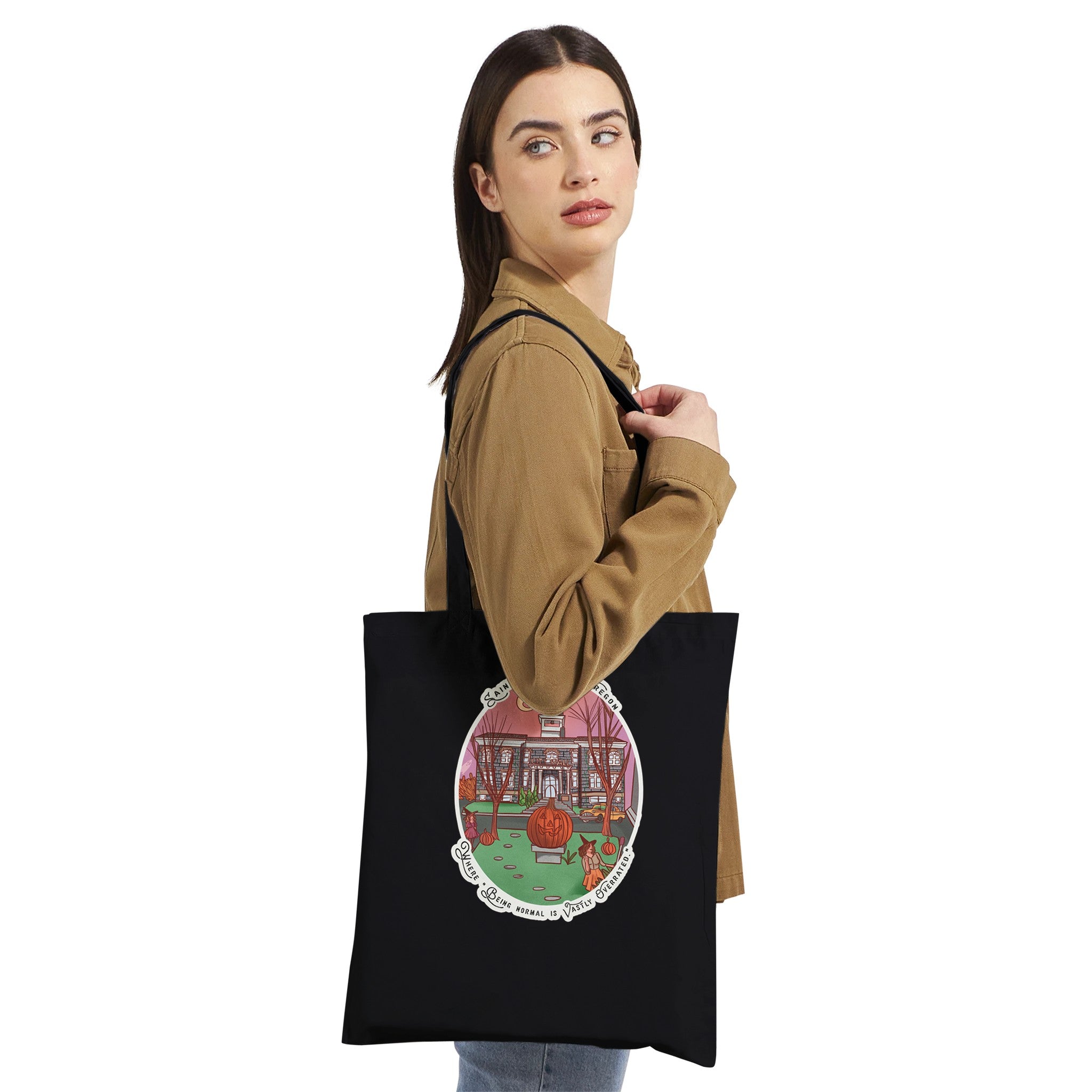 Girl standing with black halloweentown tote by Bookhouse Girl Designs